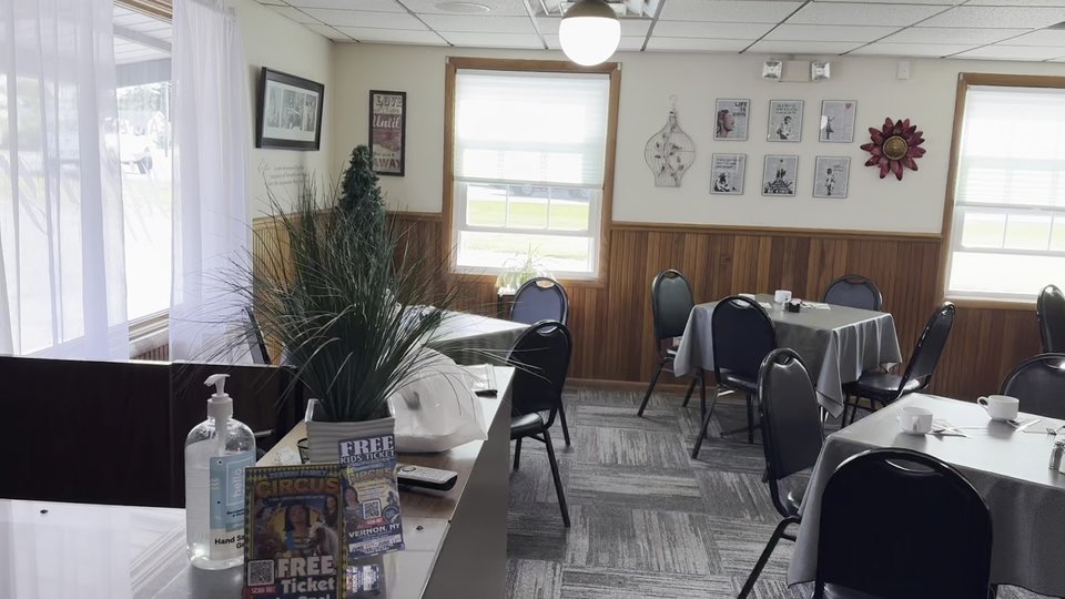 Bright breakfast tables inside a casual diner.