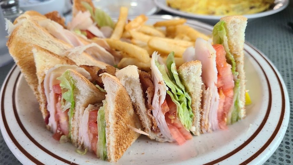 Printed menu with lunch, wraps, and salads.